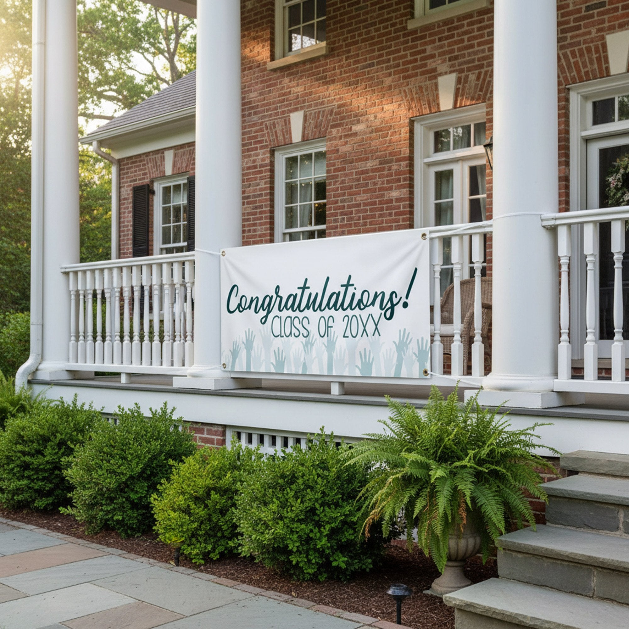 Congratulations Cheers Graduation Banner hanging from a porch railing