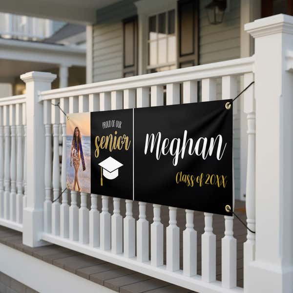 Proud of Our Senior Custom Graduation Banner On a porch railing