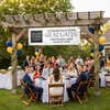 School Logo Custom Graduation Banner Hanging Up from a Pergola