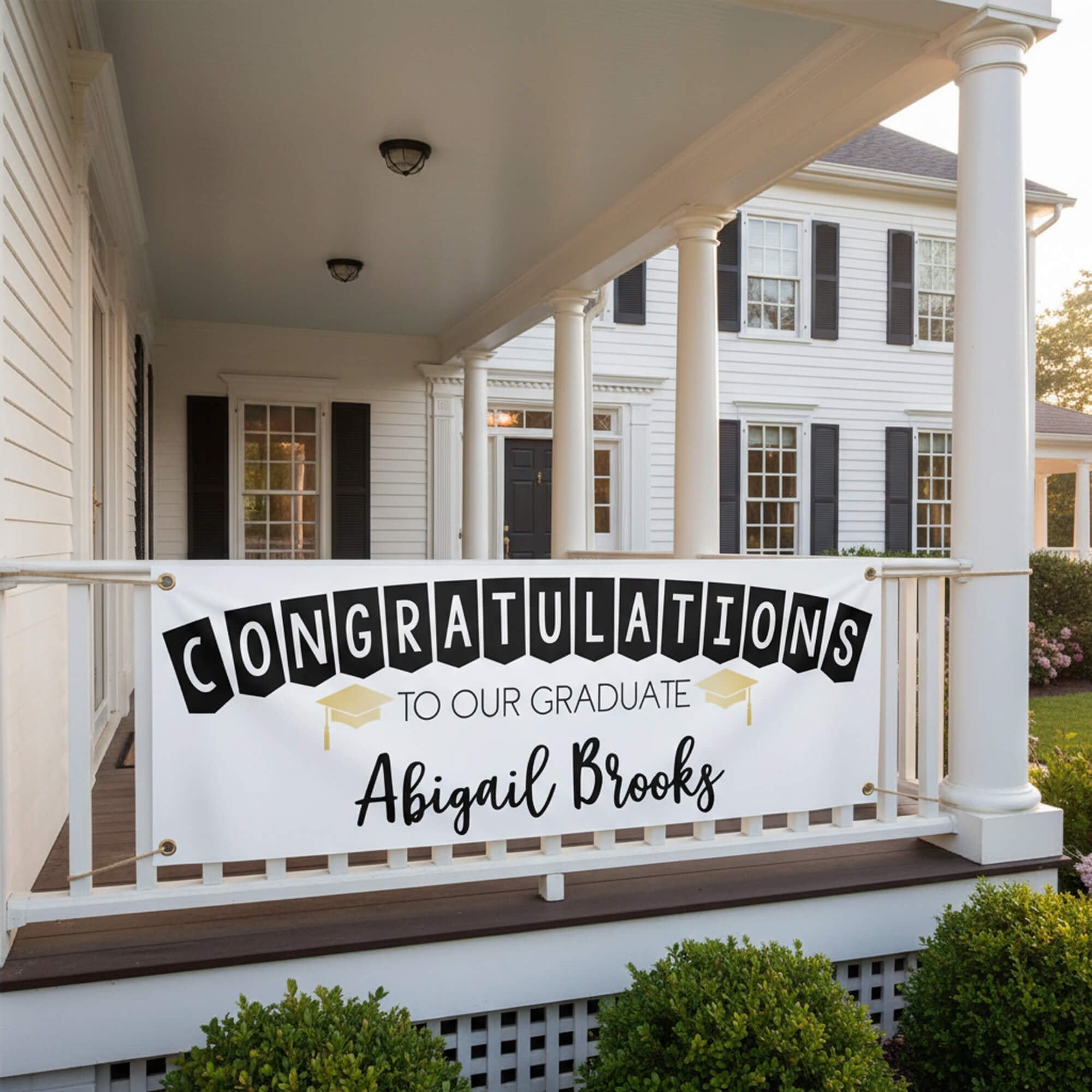 Congrats to Our Graduate Graduation Banner hanging from a porch railing
