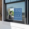 Congrats to our grad graduation yard sign in a window