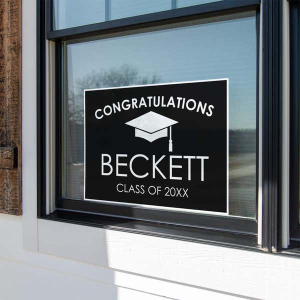 Congratulations Grad Cap Graduation Yard Sign in a Window