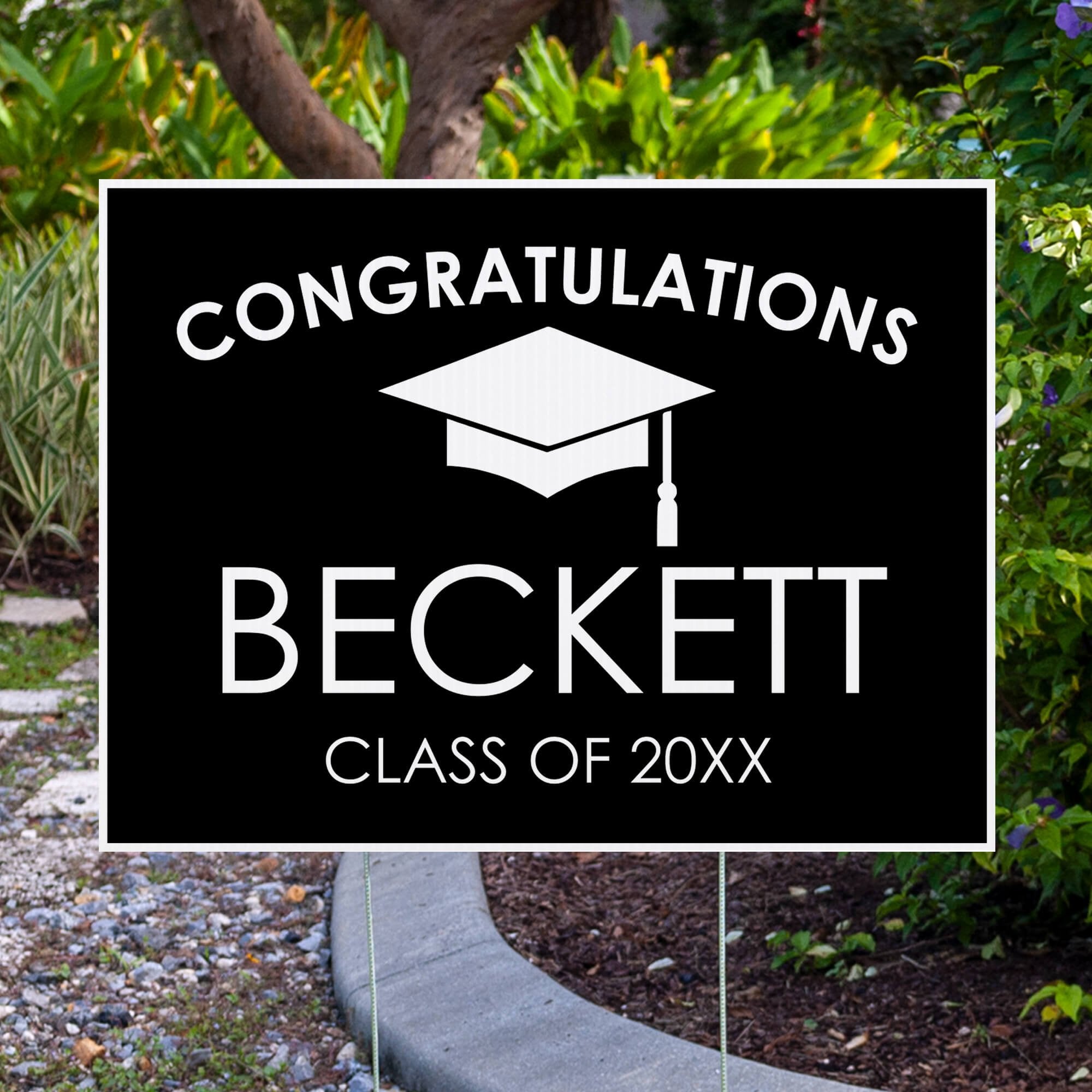 Congratulations Grad Cap Graduation Yard Sign Next to Pavement