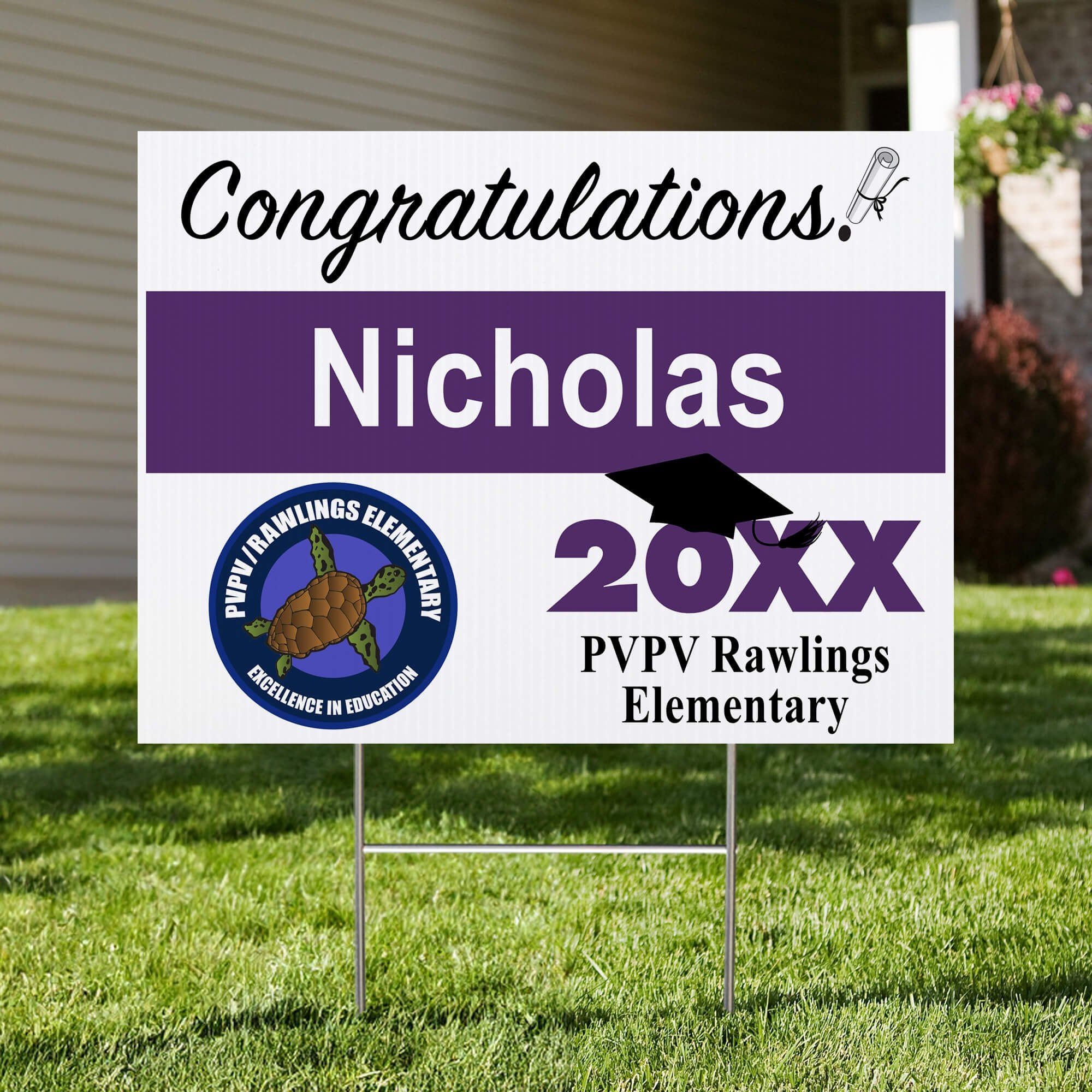 School logo graduation yard sign displayed in front yard