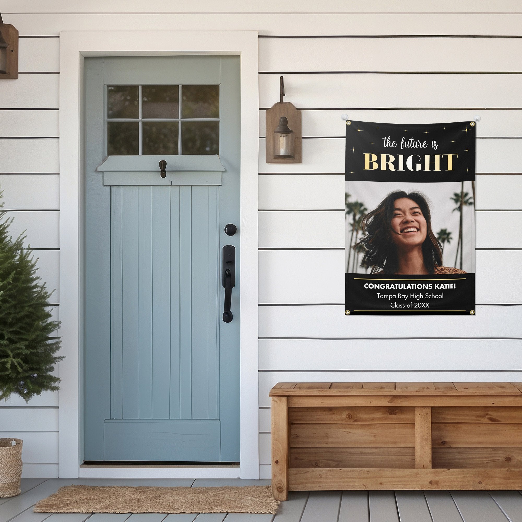 The Future Is Bright Graduation Banner hanging on a house