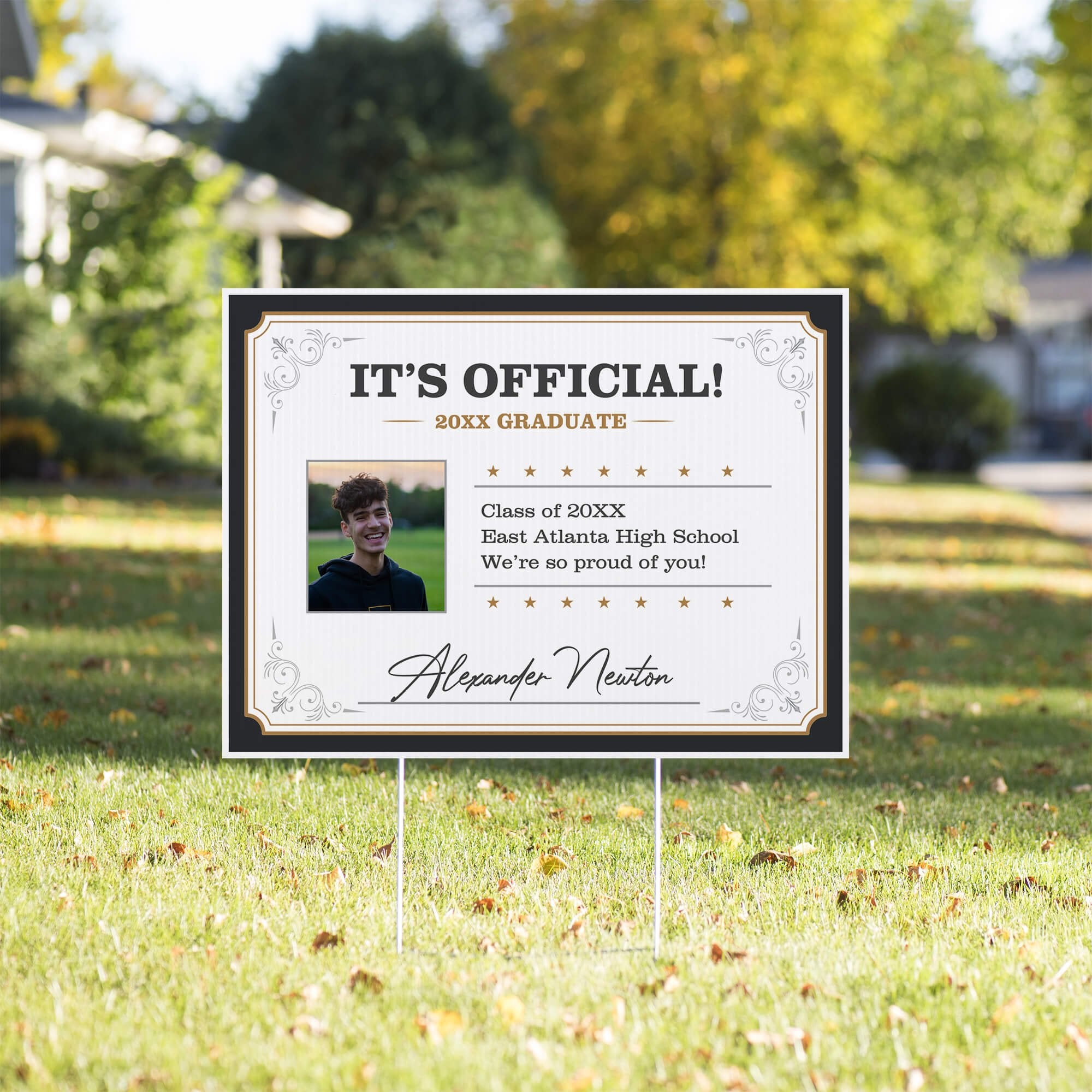 Diploma graduation yard sign displayed on a front yard