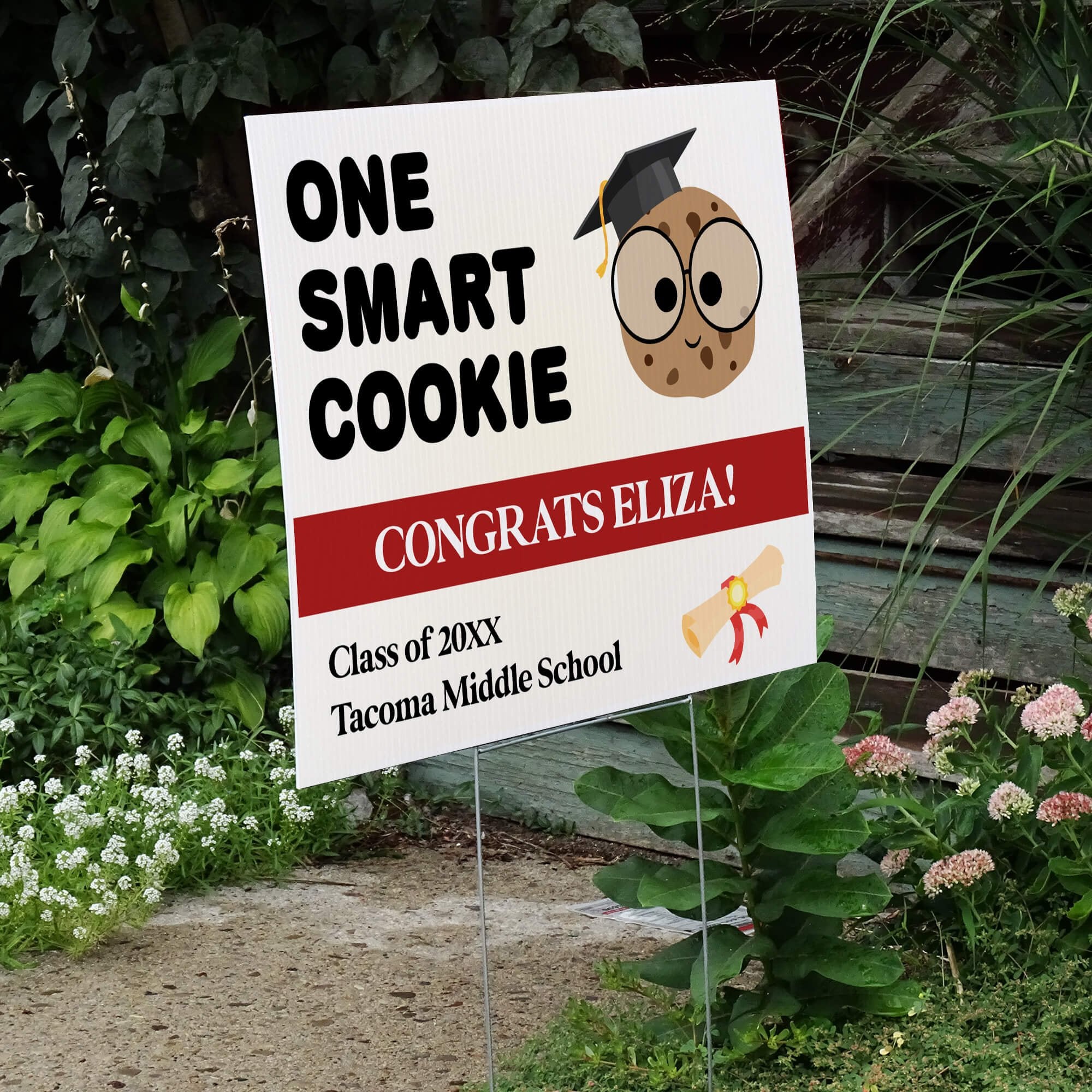 graduation yard sign displayed next to stairs
