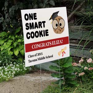 graduation yard sign displayed next to stairs