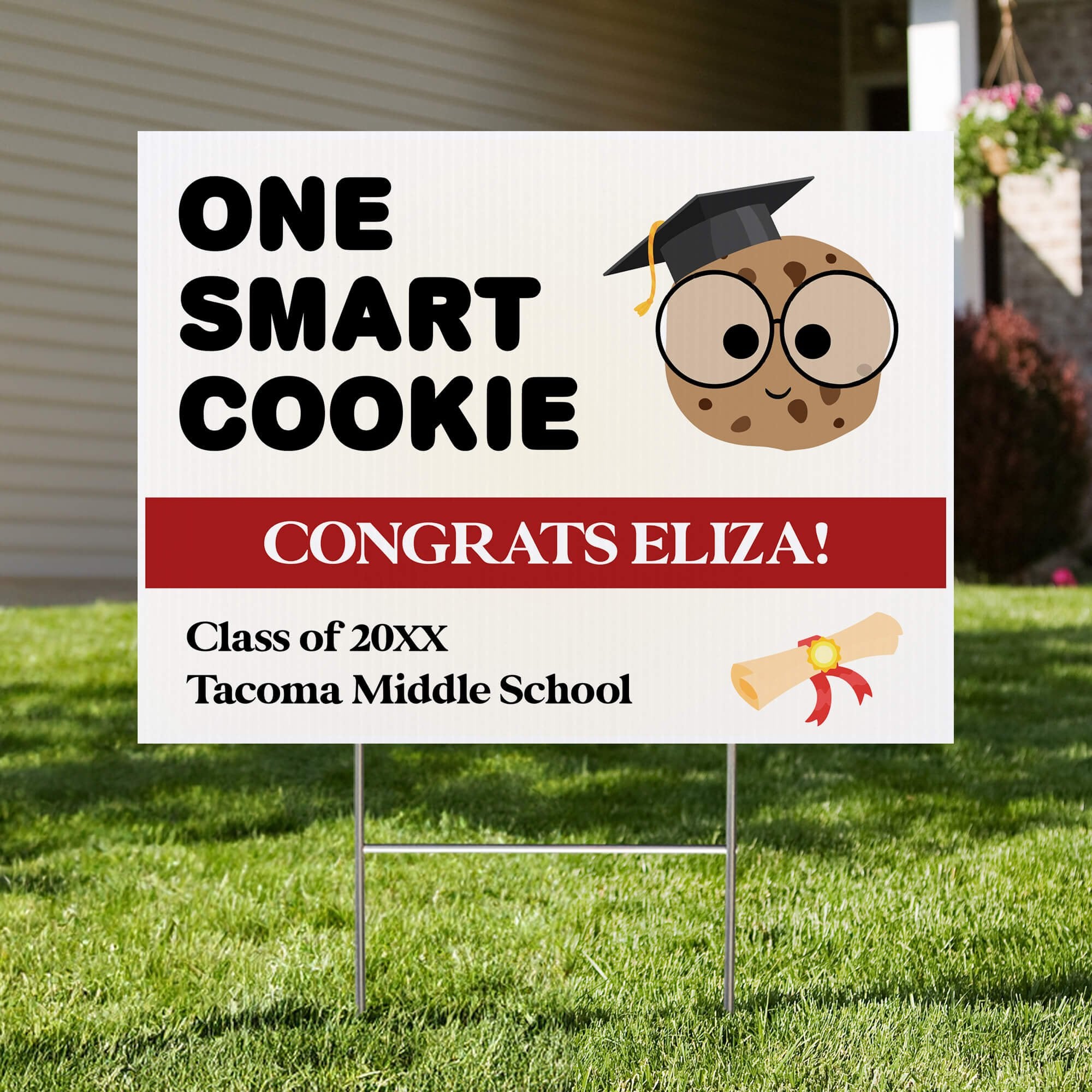 graduation yard sign displayed in a front yard