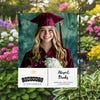 Graduation Gold Cap Garden Flag in a garden
