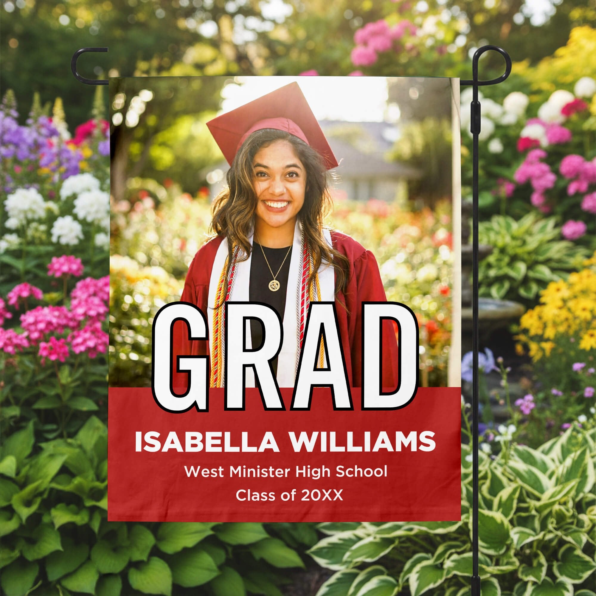 Graduation Block Lettering Garden Flag in a garden