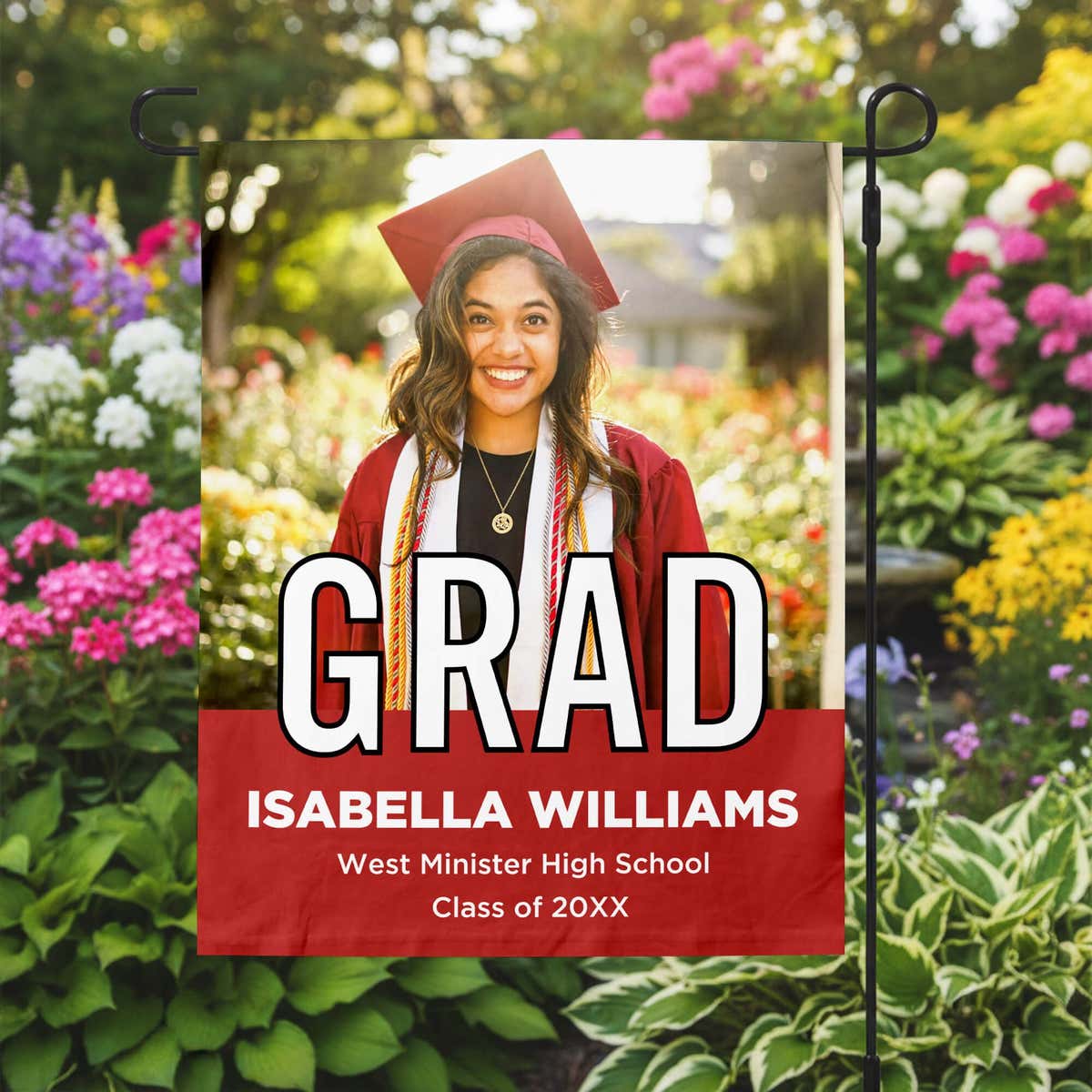 Graduation Block Lettering Garden Flag in a garden