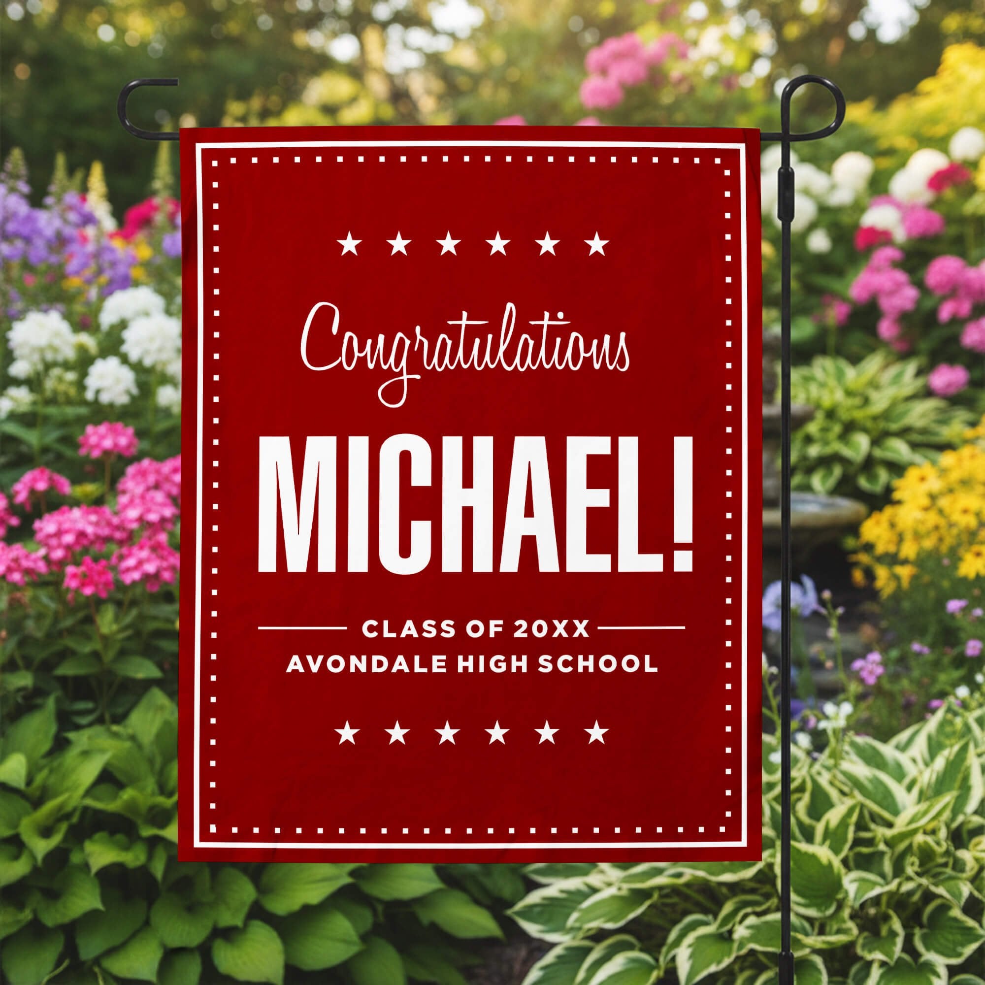 Graduation Bold Name Garden Flag in a garden