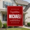 Graduation Bold Name Garden Flag in front of a house