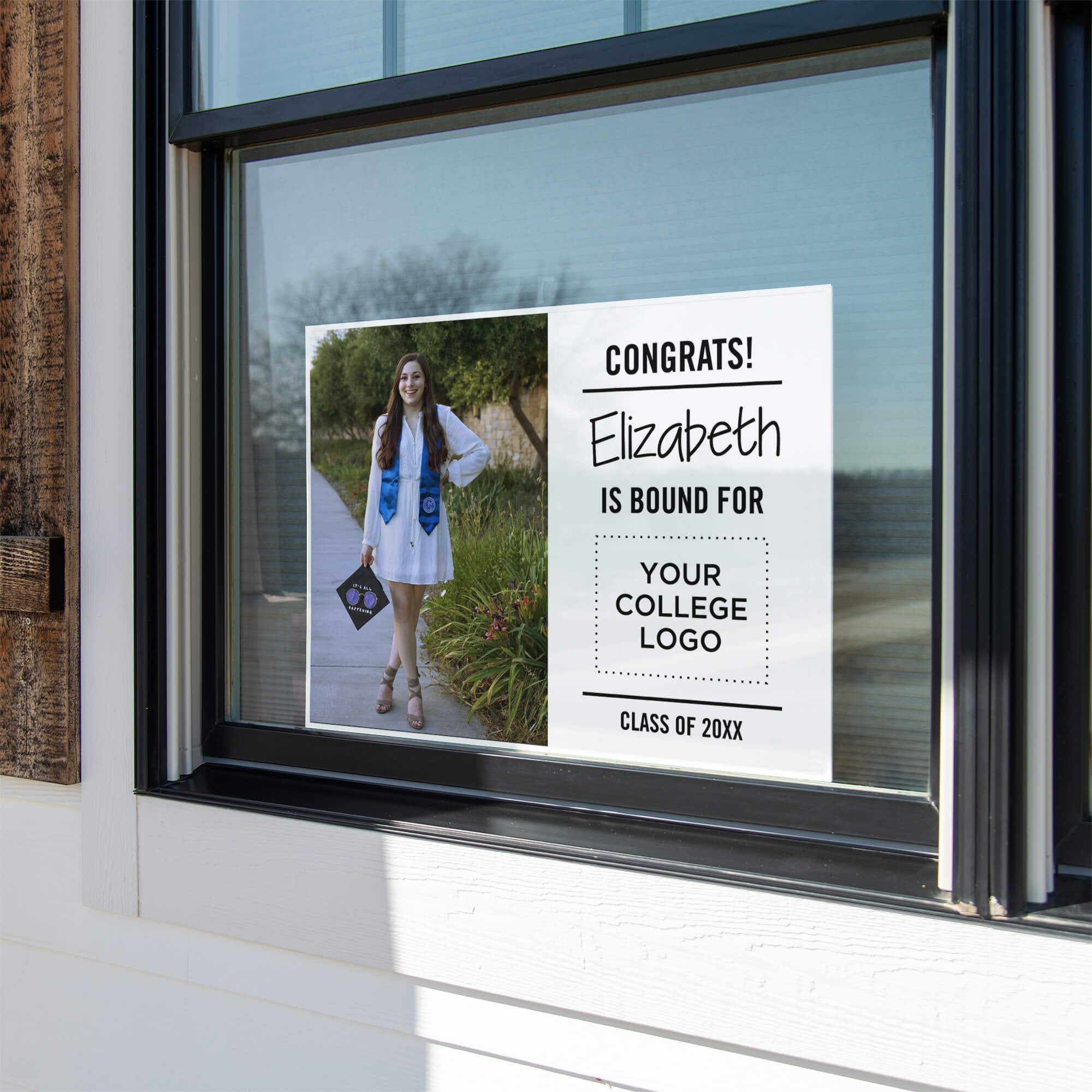 College bound graduation yard sign displayed in a window