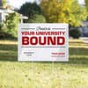 University logo graduation yard sign displayed in a sunny yard