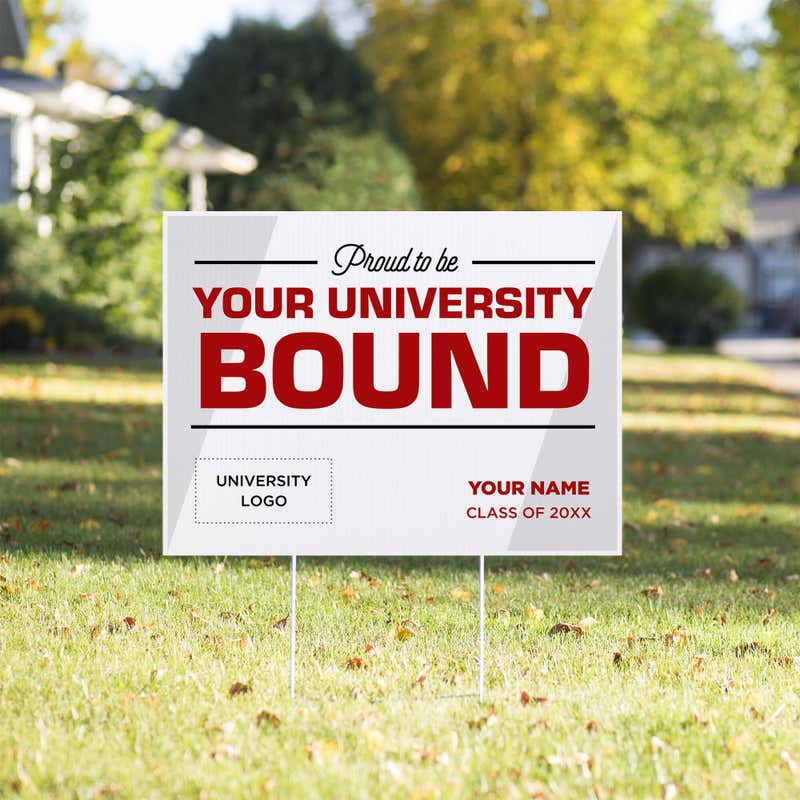 University logo graduation yard sign displayed in a sunny yard