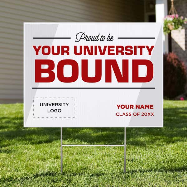 University logo graduation yard sign displayed in a front yard