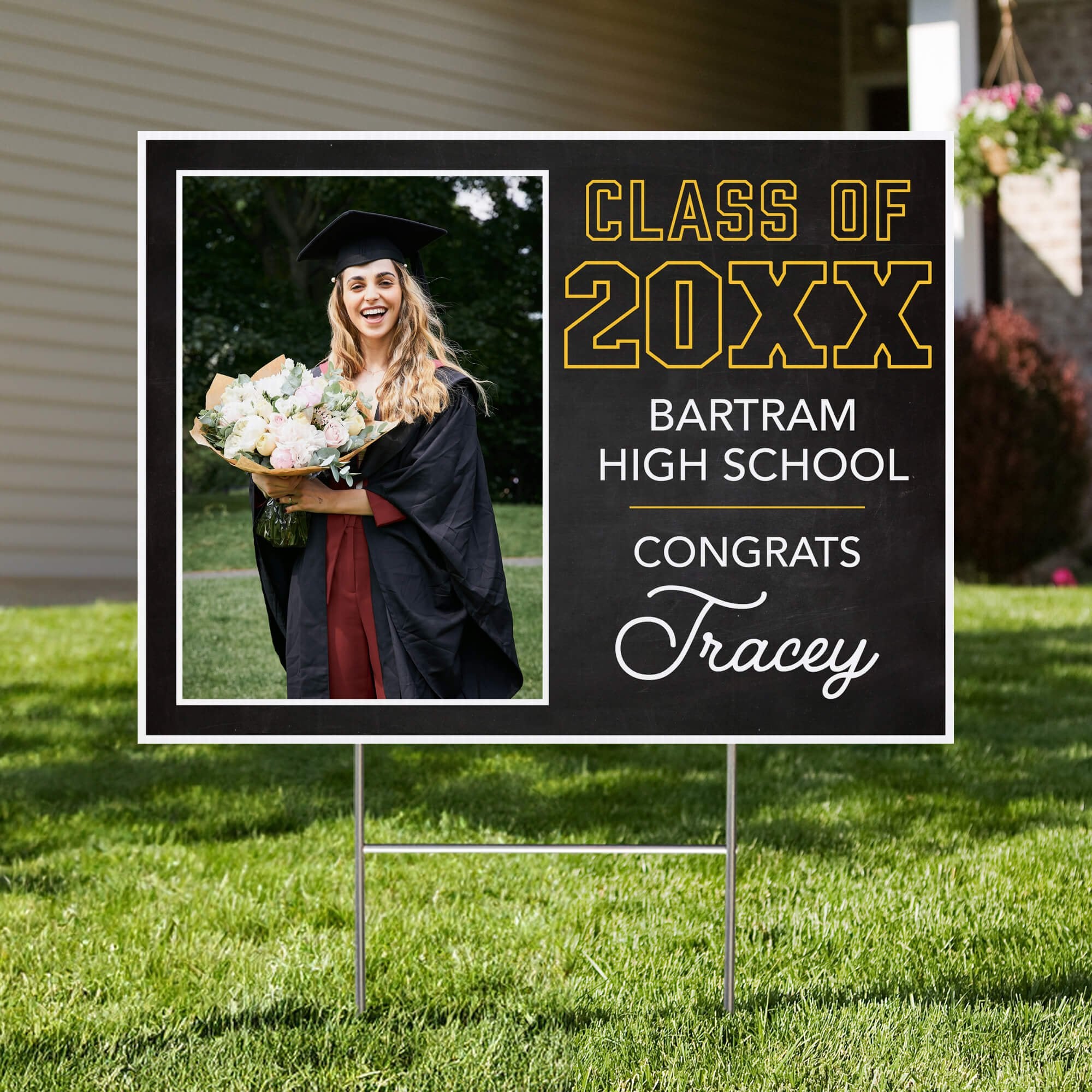 Chalkboard Design Graduation Yard Sign displayed in front of a house