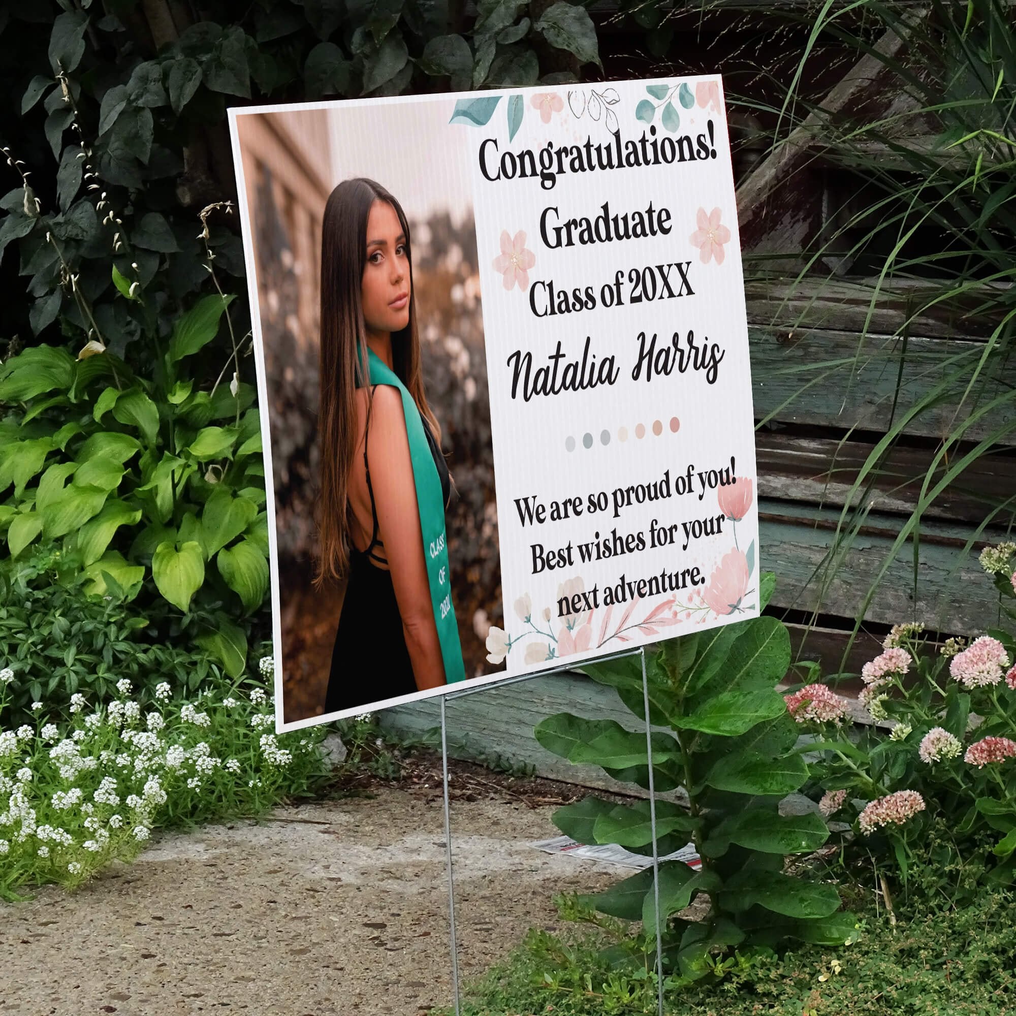 Floral Design and Note Graduation Yard Sign displayed by a pathway leading to stairs