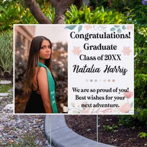 Floral Design and Note Graduation Yard Sign displayed by pavement