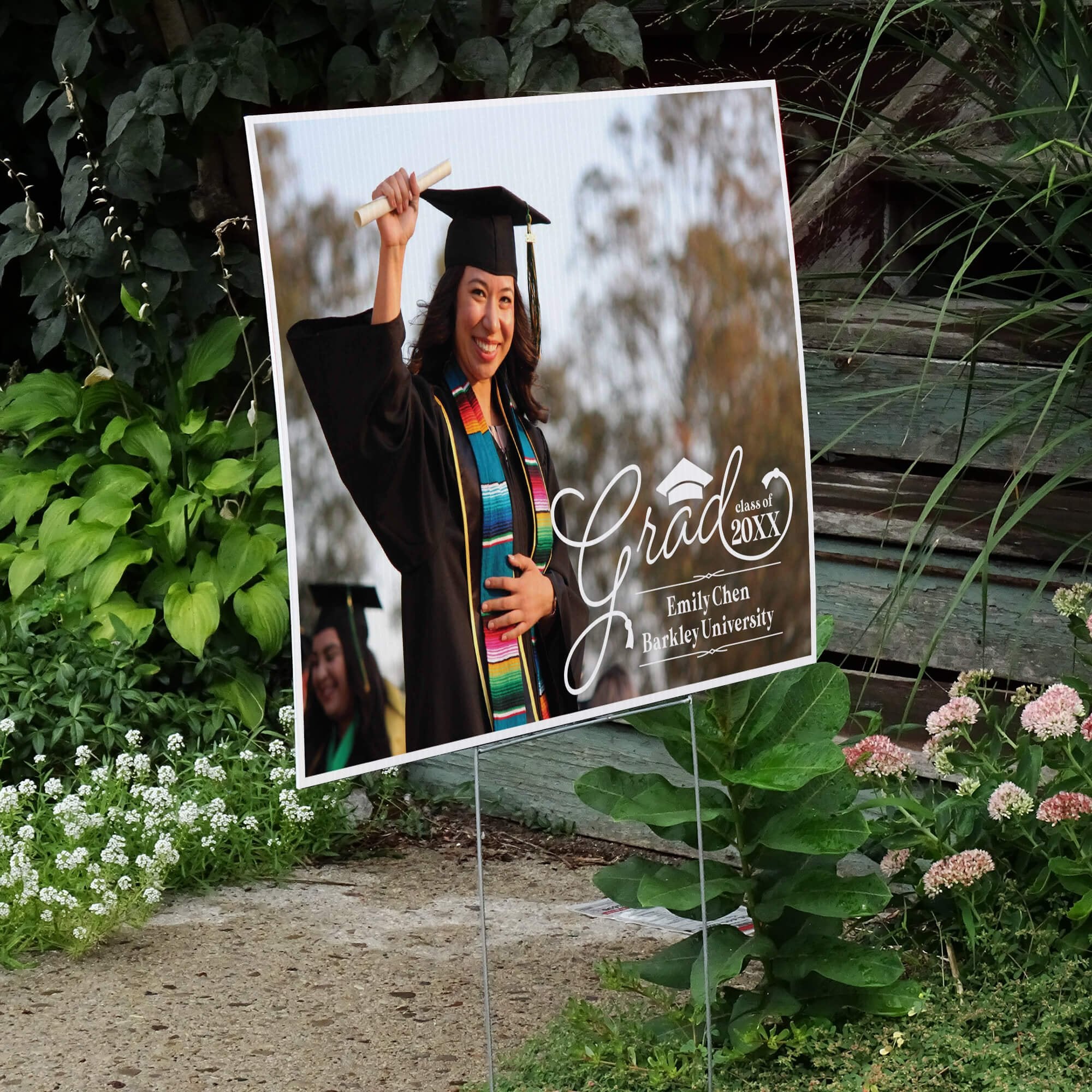Graduation Yard Sign Script Text displayed by a pathway leading to stairs