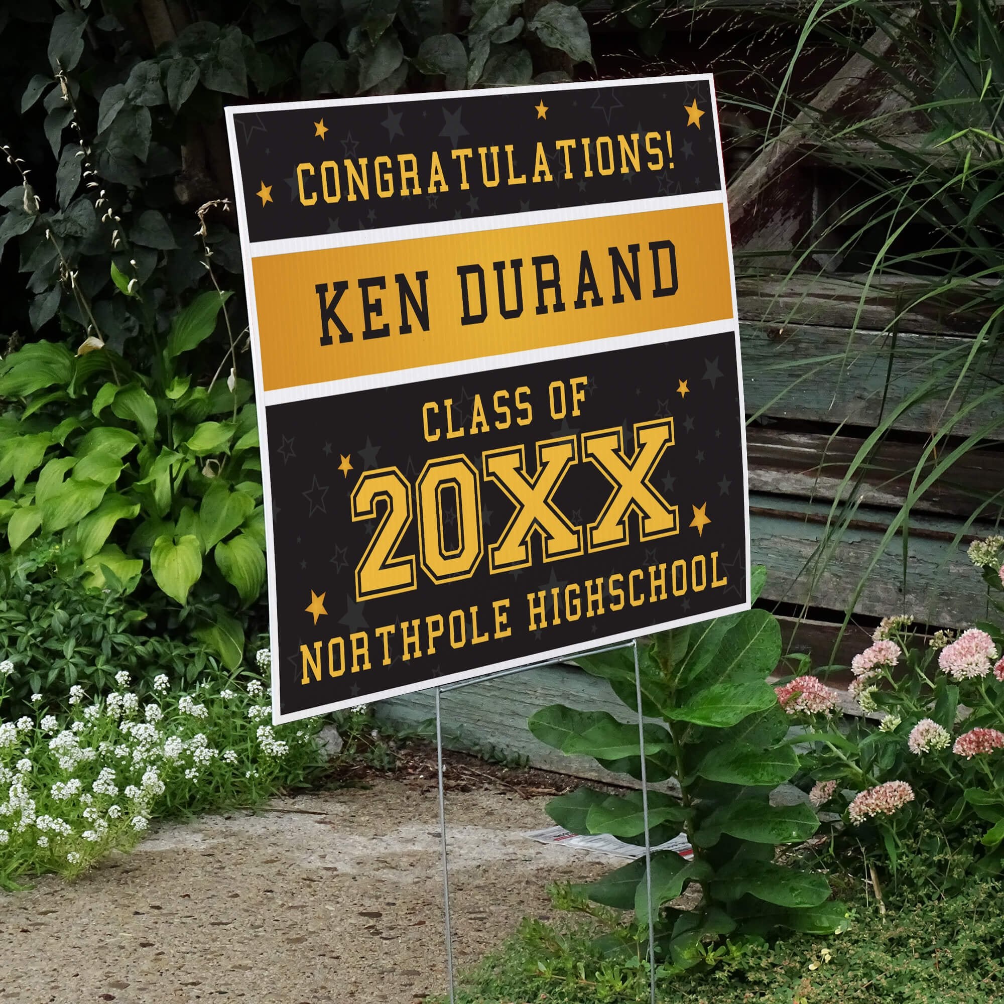 Gold Stars Graduation Yard Sign displayed by a pathway leading to stairs