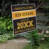 Gold Stars Graduation Yard Sign displayed by a pathway leading to stairs