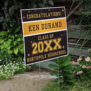 Gold Stars Graduation Yard Sign displayed by a pathway leading to stairs