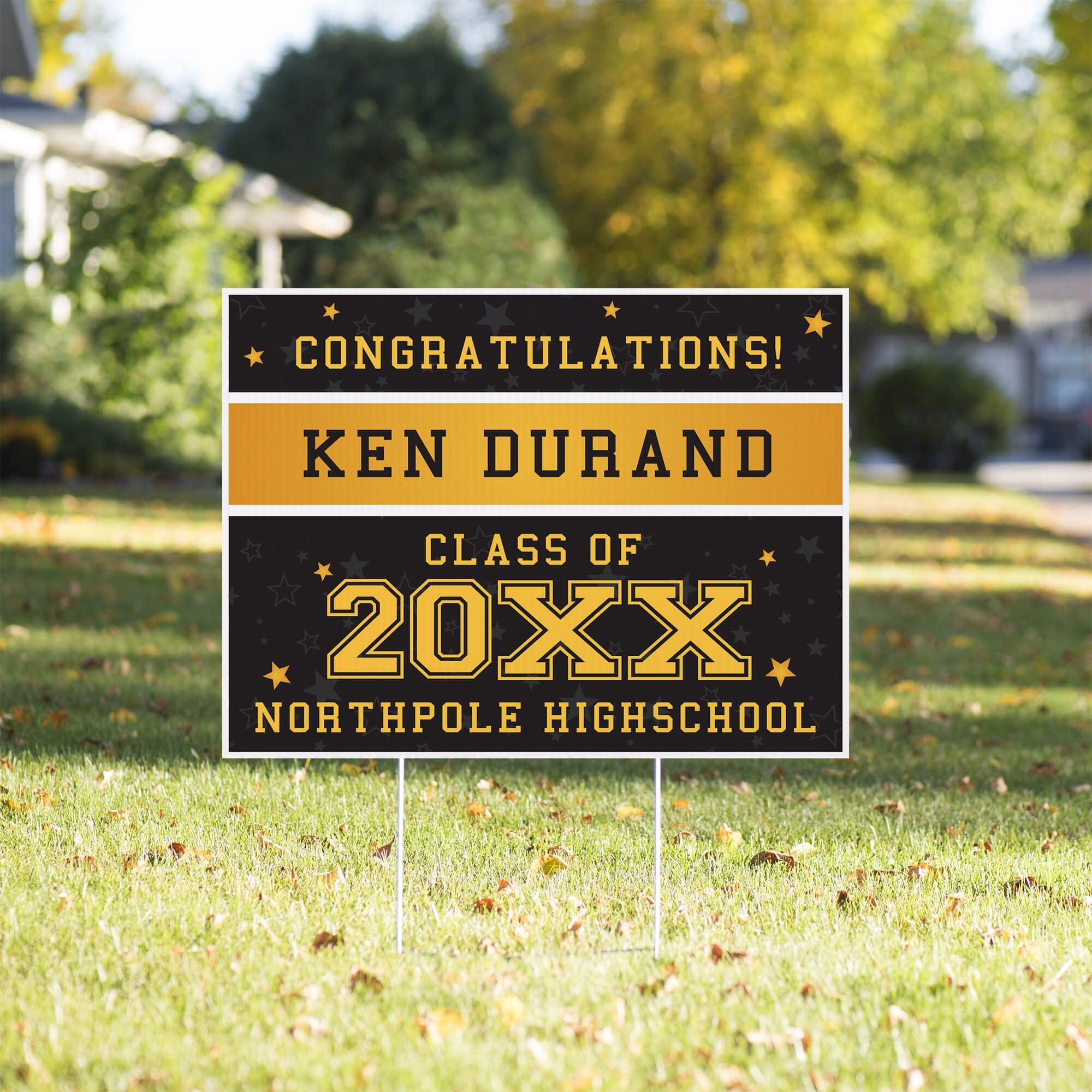 Gold Stars Graduation Yard Sign in a front yard