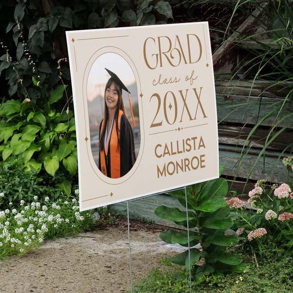 Modern Minimalist Graduation Yard Sign displayed by a pathway leading to stairs