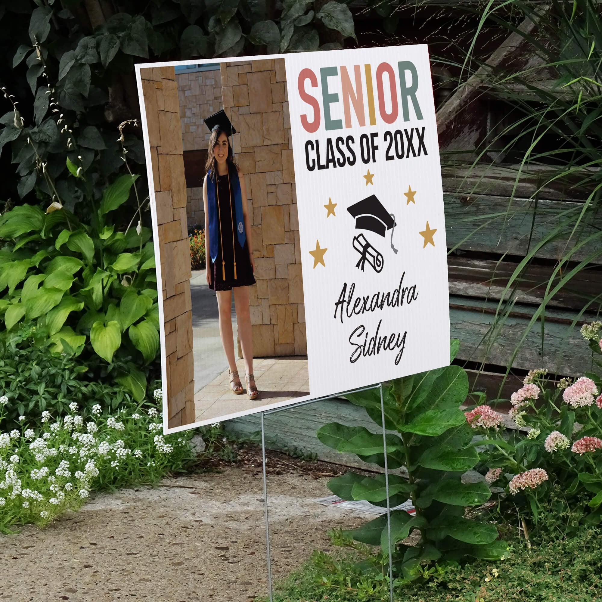 Pastels and Stars Graduation Yard Sign displayed by a pathway leading to stairs