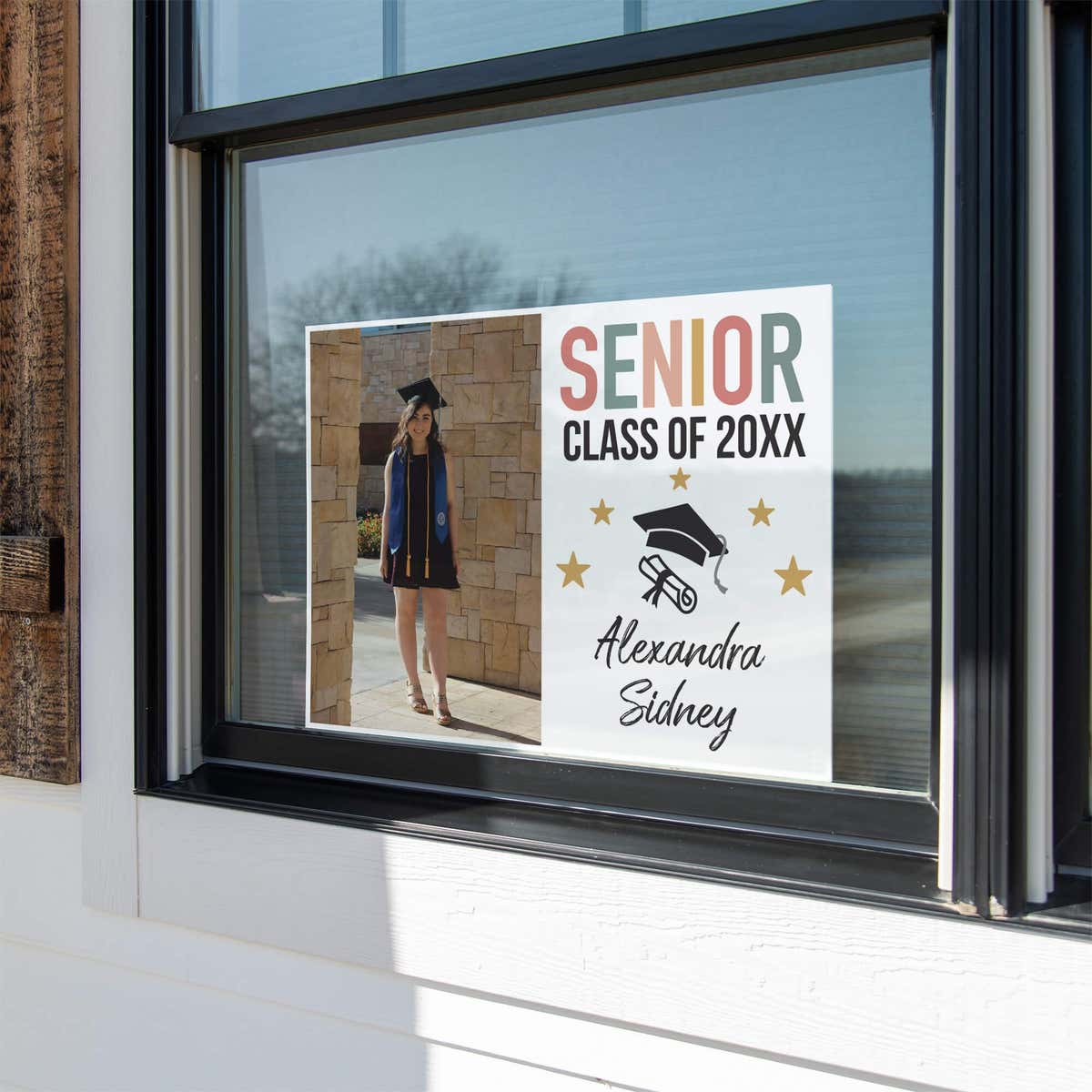 Pastels and Stars Graduation Yard Sign displayed in a window
