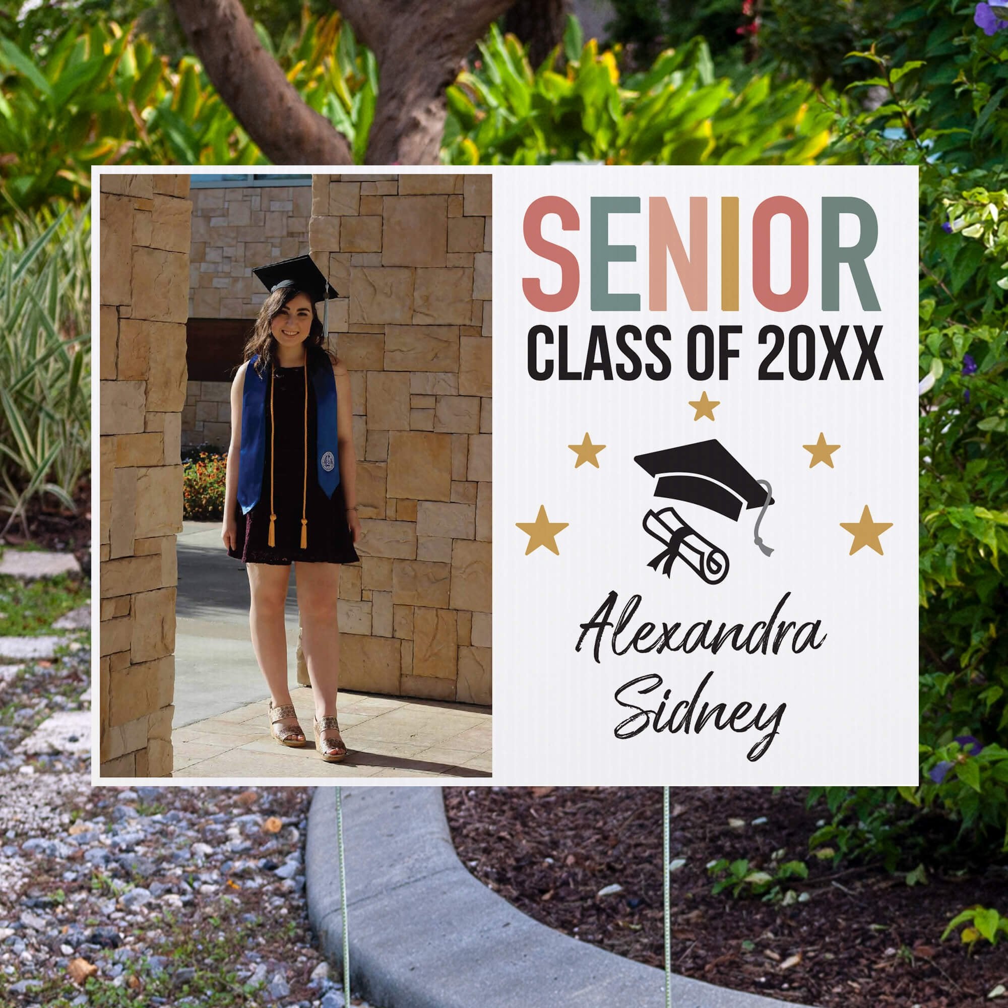 Pastels and Stars Graduation Yard Sign displayed by pavement