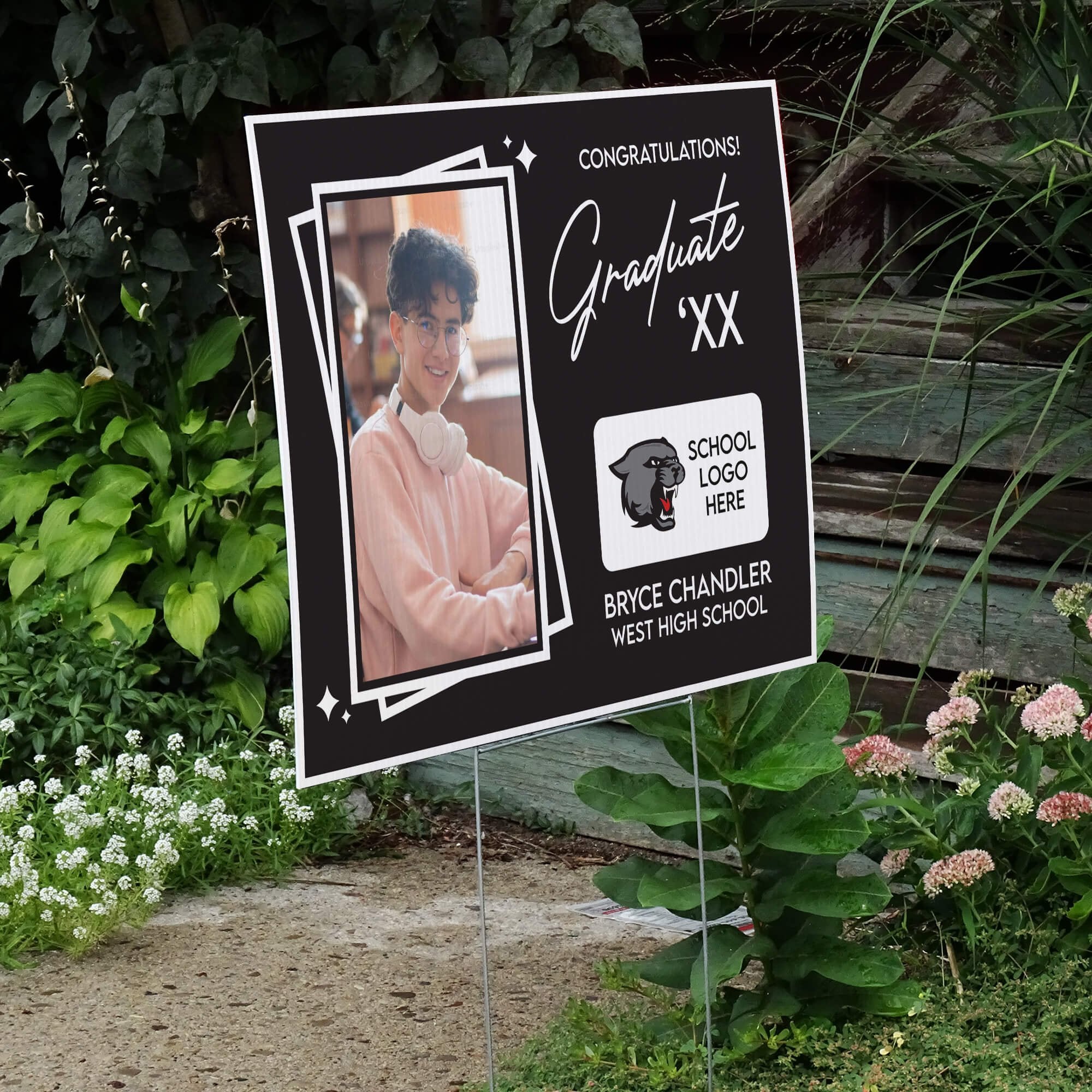 Picture Frame Graduation Yard Sign displayed by a pathway leading to stairs