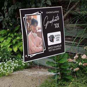 Picture Frame Graduation Yard Sign displayed by a pathway leading to stairs