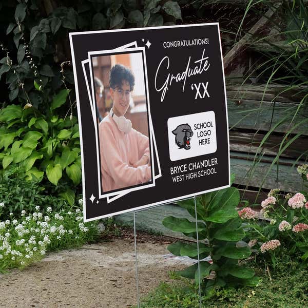 Picture Frame Graduation Yard Sign displayed by a pathway leading to stairs