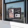 Picture Frame Graduation Yard Sign displayed in a window