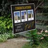 You Did It | Graduation Yard Sign displayed by a pathway leading to stairs