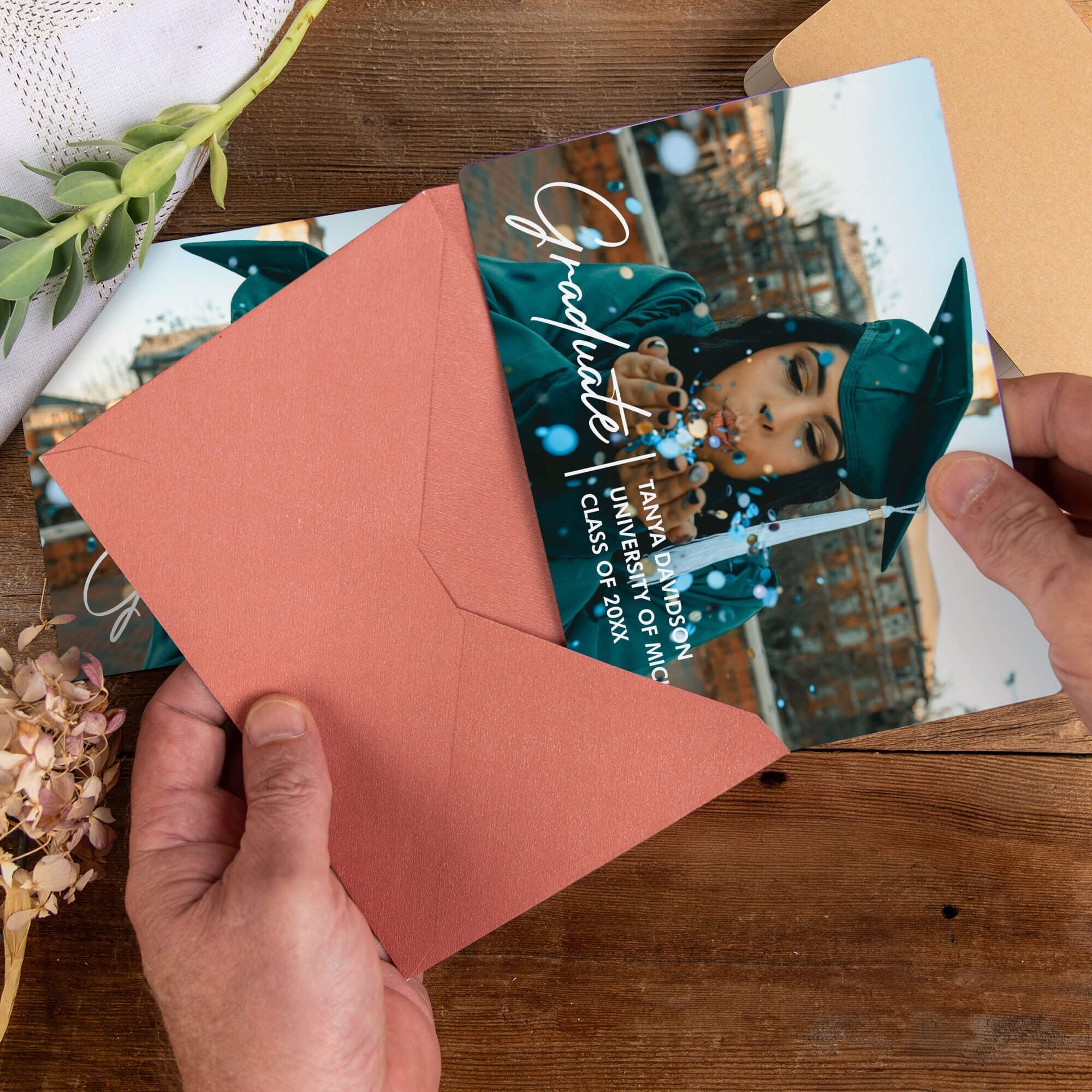 Personalized Custom Photo Graduation Announcement photo magnet being placed into a rose colored envelope