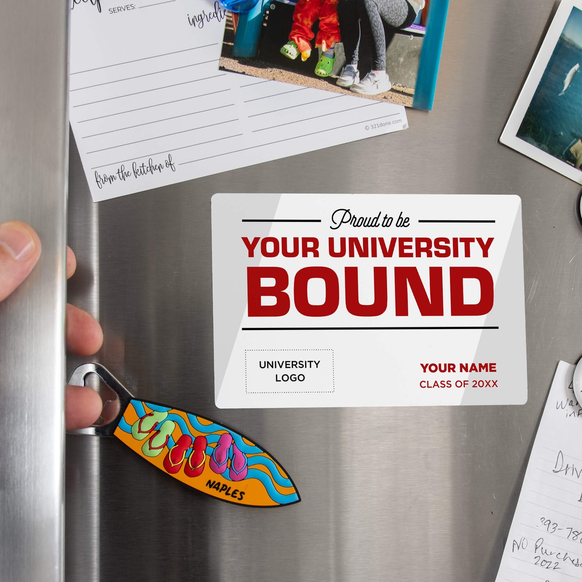 Hand placing a custom Proud to be College Bound Graduation Announcement magnet on a stainless steel refrigerator