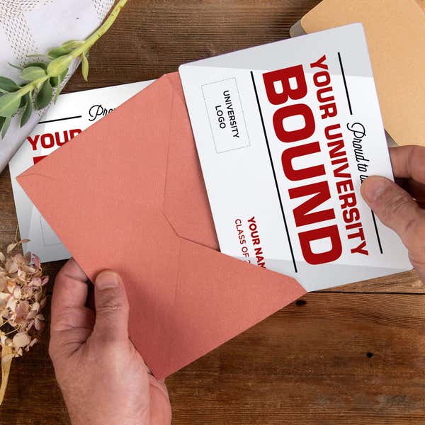 Personalized Proud to be College Bound Graduation Announcement magnet being placed into a rose colored envelope