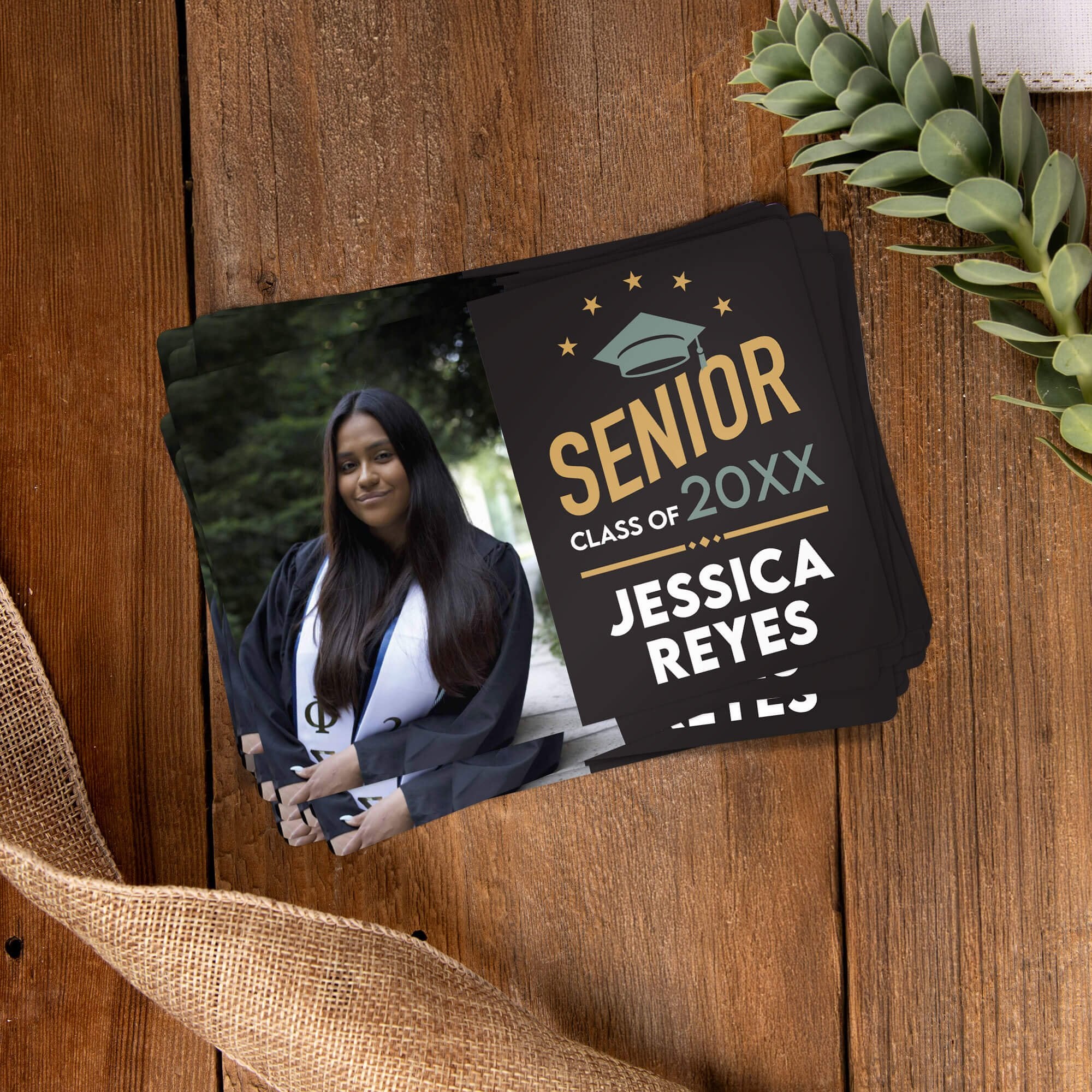 Stack of personalized Modern Design Senior Graduation Announcement magnets on a wooden table