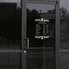 Baker Die Cut Hours of Operation Decal on a storefront window