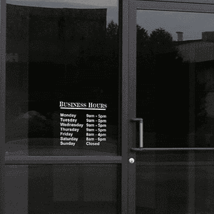 Standard Business Hours Die Cut Door Decal on a storefront window