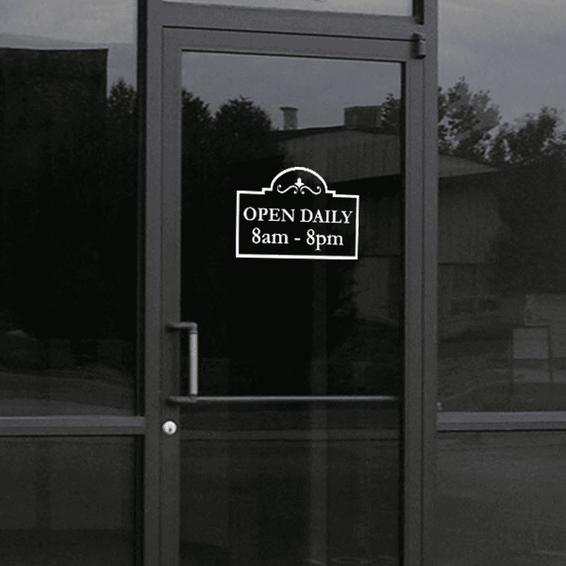 Open Daily Business Hours Die Cut Decal on a storefront window