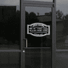 Open Hours Die Cut Door Decal on a storefront window
