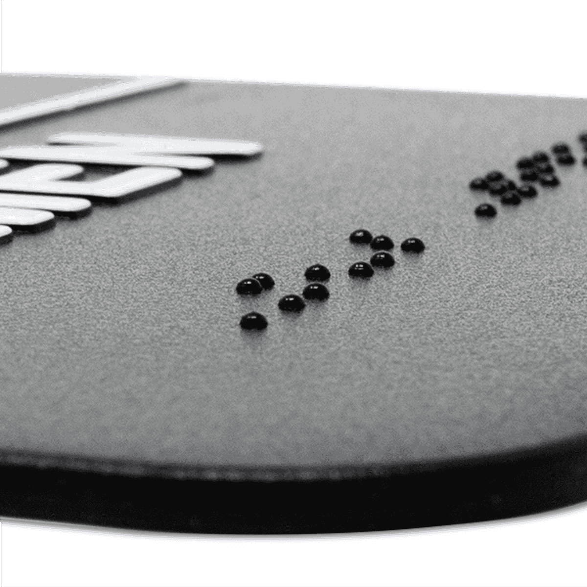 Close up of the braille on the sign