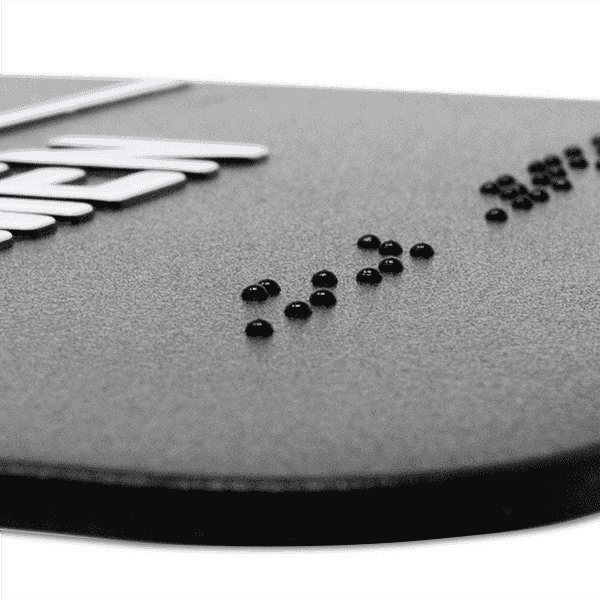 Close up of the braille on the sign