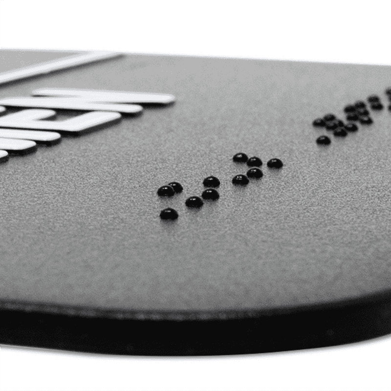 Close up of the braille on the sign